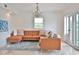 Modern living room with a comfortable sectional sofa at 10108 Kingfisher E Rd, Bradenton, FL 34209