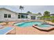 Beautiful backyard pool area featuring a spa and comfortable seating at 10108 Kingfisher E Rd, Bradenton, FL 34209