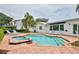 Inviting backyard pool and spa area surrounded by lush greenery at 10108 Kingfisher E Rd, Bradenton, FL 34209