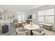 Bright and open living room with modern furnishings, neutral tones, and stylish decor at 10714 Hidden Banks Gln, Parrish, FL 34219