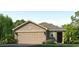 Charming single-story home with a well-manicured lawn, covered entry, and a two-car attached garage at 10725 Hidden Banks Gln, Parrish, FL 34219