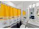 Bathroom features a shower and tub, a single sink vanity, and Steelers-themed decor at 10819 Wicker Park Pl, Palmetto, FL 34221