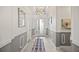 Hallway features marble floors, decorative molding, and natural light from the front door at 10819 Wicker Park Pl, Palmetto, FL 34221