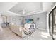 Spacious living room with lots of natural light, marble floors, stylish furniture, and an open concept design at 10819 Wicker Park Pl, Palmetto, FL 34221