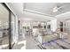 Open concept living room and kitchen area features marble floors, stainless steel appliances, and a dining room at 10819 Wicker Park Pl, Palmetto, FL 34221