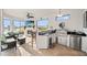 Outdoor kitchen features granite countertops, stainless steel appliances, bar seating, and a stunning backyard view at 10819 Wicker Park Pl, Palmetto, FL 34221