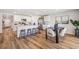 Open concept kitchen and dining area with island seating, stainless steel appliances, and modern decor at 10844 Gentle Current Way, Parrish, FL 34219
