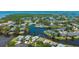 Aerial view of the community, showcasing homes and a scenic lake at 11116 Sanctuary Dr, Bradenton, FL 34209