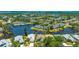 Beautiful aerial view of a waterfront property with a serene backyard and surrounding greenery at 11116 Sanctuary Dr, Bradenton, FL 34209