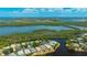 Stunning aerial view of waterfront property with lush landscaping, in a tranquil neighborhood at 11116 Sanctuary Dr, Bradenton, FL 34209