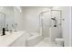 Clean bathroom with a corner shower, soaking tub, black matte faucet and vanity mirror at 11116 Sanctuary Dr, Bradenton, FL 34209