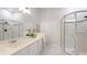 Bright bathroom features a glass shower, soaking tub and large vanity at 11116 Sanctuary Dr, Bradenton, FL 34209