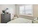 Comfortable bedroom features a gray dresser, shuttered windows and neutral paint at 11116 Sanctuary Dr, Bradenton, FL 34209