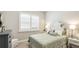 Inviting bedroom features shuttered windows, a unique headboard and neutral paint at 11116 Sanctuary Dr, Bradenton, FL 34209