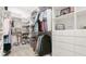 Walk-in closet with custom shelving and ample space for organization and storage at 11116 Sanctuary Dr, Bradenton, FL 34209