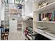 Organized walk-in closet features custom shelving and ample storage space at 11116 Sanctuary Dr, Bradenton, FL 34209