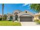 Beautiful single-Gathering home with a well-maintained lawn and attached two-car garage at 11116 Sanctuary Dr, Bradenton, FL 34209
