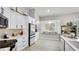 White kitchen featuring a bay window seating area, stainless steel appliances and bright countertops at 11116 Sanctuary Dr, Bradenton, FL 34209