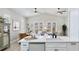 Open kitchen with island sink and bright view to dining and living areas at 11116 Sanctuary Dr, Bradenton, FL 34209