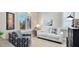 Inviting living room features shuttered windows, neutral paint and a comfortable sofa at 11116 Sanctuary Dr, Bradenton, FL 34209