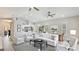 Spacious living room with stylish furnishings, vaulted ceilings, and an abundance of natural light at 11116 Sanctuary Dr, Bradenton, FL 34209