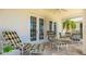 Covered patio featuring a seating area and French doors leading indoors at 11116 Sanctuary Dr, Bradenton, FL 34209