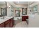 Bathroom with dual sinks, soaking tub and framed mirrors at 11592 57Th Street E Cir, Parrish, FL 34219