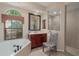 Bright bathroom featuring a garden tub and stand up shower at 11592 57Th Street E Cir, Parrish, FL 34219