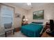 Inviting bedroom with neutral walls, quaint furniture, and a decorative painting at 11592 57Th Street E Cir, Parrish, FL 34219