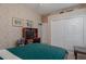 Comfortable bedroom with wall-to-wall closet, workspace and neutral toned walls at 11592 57Th Street E Cir, Parrish, FL 34219