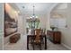 Elegant dining room features decorative wall molding, an archway, and natural light from the two windows at 11592 57Th Street E Cir, Parrish, FL 34219