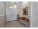 Grand foyer features tile flooring, high ceilings, decorative trim and a statement chandelier at 11592 57Th Street E Cir, Parrish, FL 34219