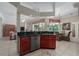 Kitchen bar area leading into a living room with an adjacent breakfast nook at 11592 57Th Street E Cir, Parrish, FL 34219