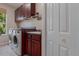 Functional laundry room with modern appliances, countertops, and ample cabinet space at 11592 57Th Street E Cir, Parrish, FL 34219