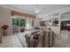 Inviting living room with tile floors, neutral walls, and a view of the lanai and backyard at 11592 57Th Street E Cir, Parrish, FL 34219