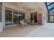 Outdoor patio with ceiling fans, dining area, tile floors, and relaxing backyard views at 11592 57Th Street E Cir, Parrish, FL 34219
