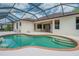 Sparkling pool, a brick trim, set in an enclosed lanai with direct access from the home at 11592 57Th Street E Cir, Parrish, FL 34219