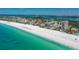 Beautiful aerial view of pristine white sand beach and turquoise water at Lido Beach Club in Sarasota, Florida at 1212 Benjamin Franklin Dr # 503, Sarasota, FL 34236