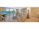 Living room with large windows, neutral tones, and stylish decor offering views of the coastline at 1212 Benjamin Franklin Dr # 503, Sarasota, FL 34236