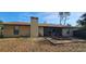 A backyard features a patio area, a chimney and green grass at 1218 Carmella Ln, Sarasota, FL 34243