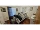Comfortable bedroom features stylish black and white decor and plenty of natural light at 1218 Carmella Ln, Sarasota, FL 34243