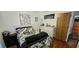 Well-lit bedroom with hardwood floors and a black and white color scheme at 1218 Carmella Ln, Sarasota, FL 34243