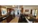 Traditional kitchen boasts black countertops, stainless steel appliances and wood cabinets at 1218 Carmella Ln, Sarasota, FL 34243