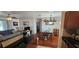 Open living area showcases a dining table, with a sectional couch visible in the connected living room at 1218 Carmella Ln, Sarasota, FL 34243