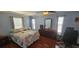 Spacious main bedroom boasts hard wood floors, plenty of natural light and neutral paint at 1218 Carmella Ln, Sarasota, FL 34243
