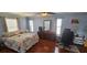 Spacious main bedroom boasts hard wood floors, plenty of natural light and neutral paint at 1218 Carmella Ln, Sarasota, FL 34243