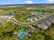 Aerial view showcases neighborhood pool and landscaping with addresses for the houses at 12706 Cobalt Ter, Bradenton, FL 34211
