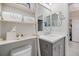 Bathroom featuring a white vanity, decorative shelving, and modern fixtures at 12706 Cobalt Ter, Bradenton, FL 34211