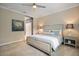 Serene bedroom with a neutral color scheme, carpet, and stylish furnishings at 12706 Cobalt Ter, Bradenton, FL 34211