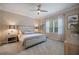 Comfortable bedroom featuring a neutral color palette, carpet, and soft lighting at 12706 Cobalt Ter, Bradenton, FL 34211